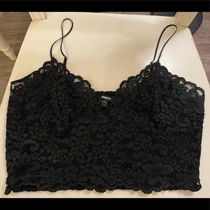Lacey black crop top with sweetheart neckline.